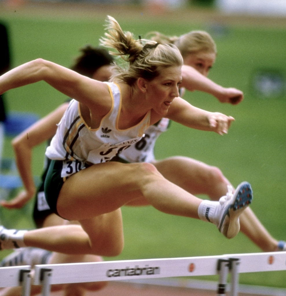 Jane Fleming jumps over hurdles